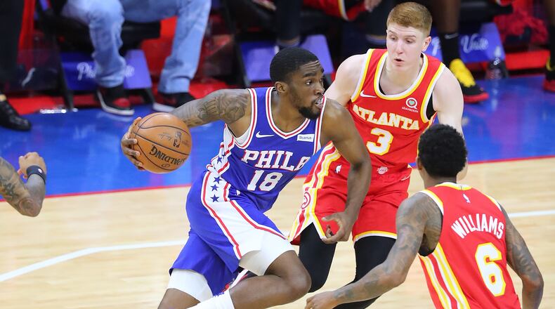 Philadelphia 76ers guard Shake Milton drives to the basket past Atlanta Hawks defenders Kevin Huerter and Lou Williams in Game 2 of the NBA Eastern Conference semifinals series on Tuesday, June 8, 2021, in Philadelphia. Curtis Compton / Curtis.Compton@ajc.com