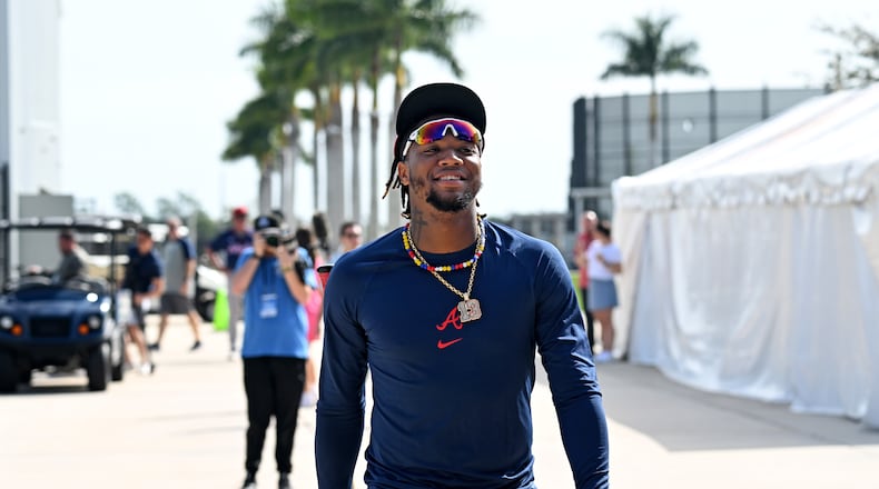 Atlanta Braves right fielder Ronald Acuna Jr. smiles as he walks to the field to take batting practice during spring training workouts at CoolToday Park, Friday, February, 16, 2024, in North Port, Florida. (Hyosub Shin / Hyosub.Shin@ajc.com)