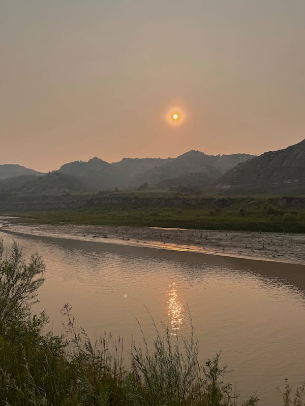 This photo taken by Joel Crane shows smoky skies on Friday, July 11, 2025, near Medora, N.D.. (Joel Crane via AP)