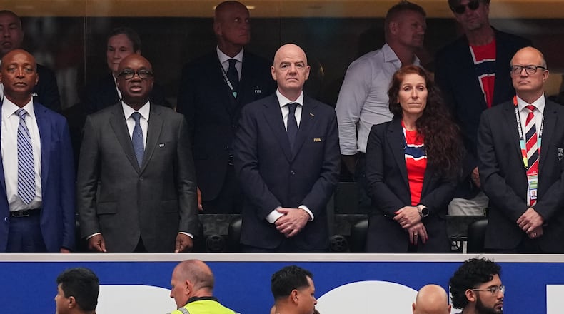 FIFA President Gianni Infantino, front center, and Norway's Football Federation president Lise Klavenessin, front second right, the stands ahead of the World Cup round of 32 soccer match between Ivory Coast and Norway in Arlington, Texas, near Dallas, Tuesday, June 30, 2026. (AP Photo/Julio Cortez)