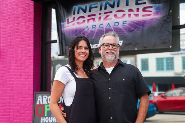 Owners Chris and Tiffany Brennaman at their new business, Infinite Horizons Arcade in Tucker. Arcade culture helped bring them together as high school sweethearts in their hometown of Macon in the early 1990s. (Abbey Cutrer/AJC)
