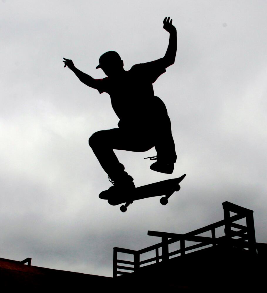 Michael Moore, from Marietta, practices his skate board technique in Kennesaw.