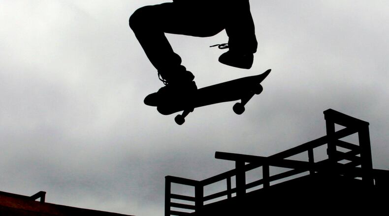 Michael Moore, from Marietta, practices his skate board technique in Kennesaw.