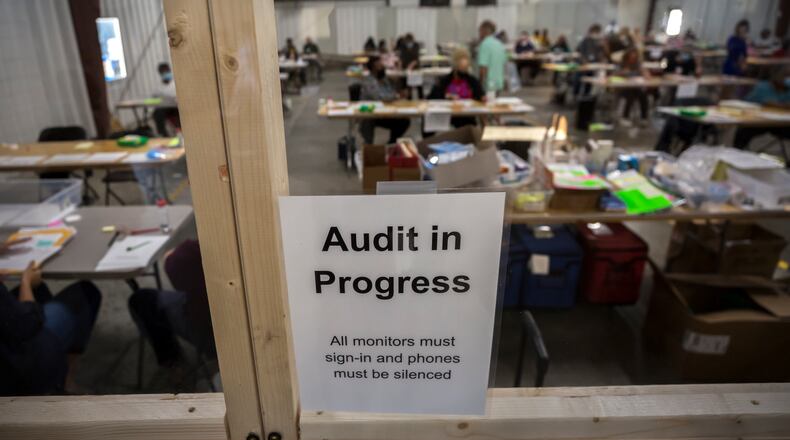 SAVANNAH, GA - NOVEMBER 14, 2020: Chatham County Board of Elections officials post signs in the public viewing area during the statewide audit of ballots from the 2020 election. (AJC Photo/Stephen B. Morton)