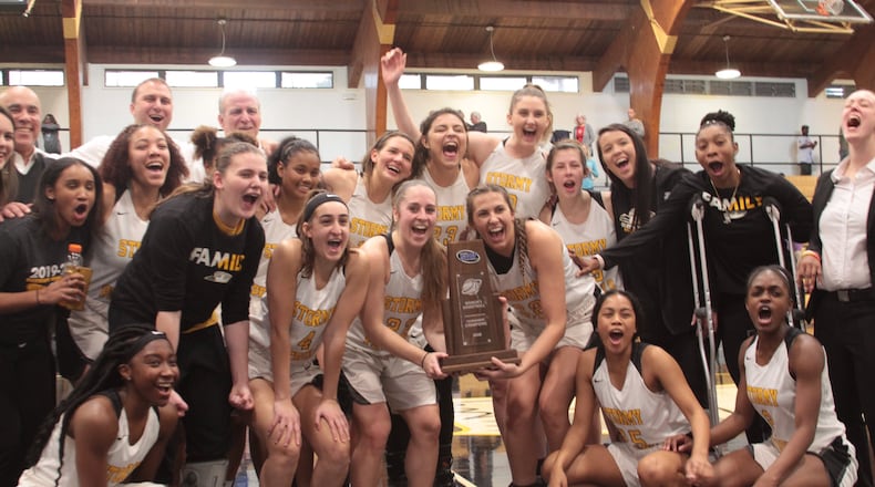 The Oglethorpe women's basketball team after winning the Southern Athletic Association tournament championship March 1 at Oglethorpe's Dorough Field House. The university announced on July 16, 2020 that its fall sports schedule has been postponed and some spring programs, such as basketball, will be altered by the decision. (Photo courtesy Savannah LeGate)