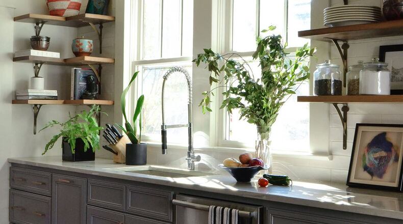 Stephanie Andrews of Balance Design Atlanta, used open shelving in a Lake Claire kitchen to create an airy atmosphere in a space with a single focal point of natural light. PHOTO CREDIT: Danielle Clockel