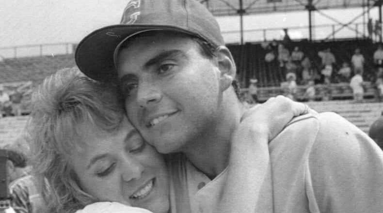 Georgia pitcher Mike Rebhan gets a hug from his wife, Patricia, after he was named MVP of the 1990 College World Series in Omaha, Neb.