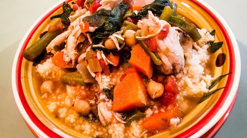Simple North African Stew is served here over a bowl of couscous, but you could use rice, quinoa, millet or any other grain. LIGAYA FIGUERAS / LFIGUERAS@AJC.COM
