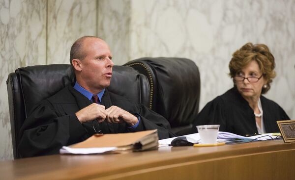Georgia Court of Appeals Judge William M. Ray II, who is now a federal judge, speaks as Presiding Judge Anne Elizabeth Barnes listens during arguments Thursday on whether the state violated a Ku Klux Klan group’s constitutional rights by denying its application in a highway cleanup program. The Georgia group’s application for the Adopt-A-Highway program was denied in 2012. The American Civil Liberties Union Foundation sued on the group’s behalf, saying its right to free speech was violated. (David Goldman/AP)