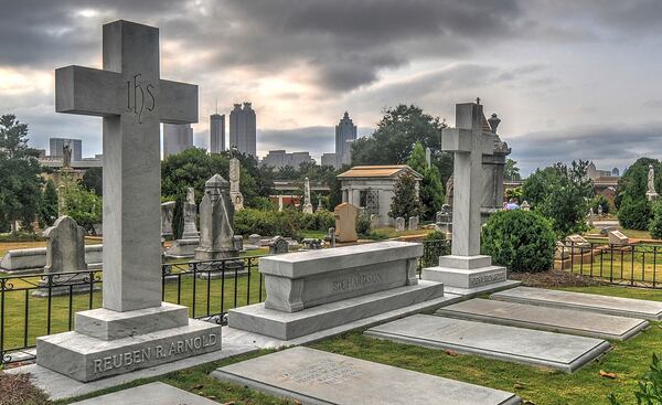 Late evening sun sets on Oakland Cemetery after a historic tour of the cemetery lead by volunteers on July 19, 2014. 