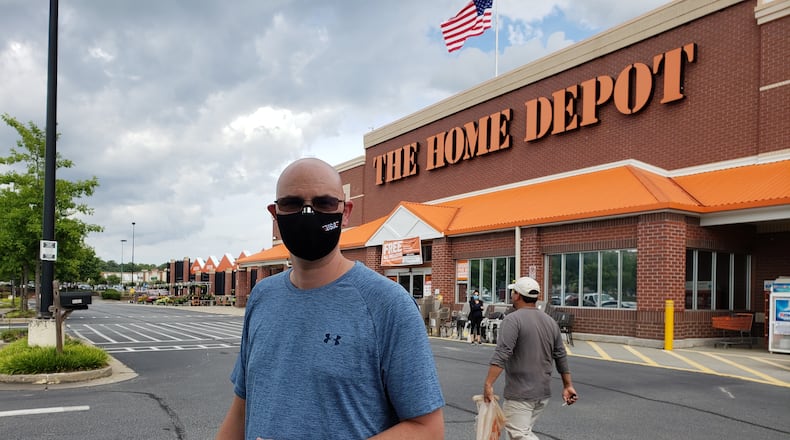 Stephen Russell, a customer at a Home Depot in Lilburn, said he likes the idea of local retailers now requiring customers to wear masks in stores during the coronavirus pandemic. He questioned, though, why they don't try harder to enforce their new rules. MATT KEMPNER / AJC