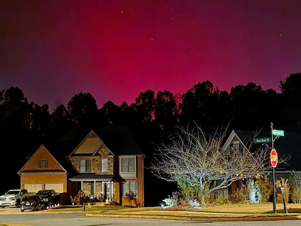 A glowing sky from the northern lights is shines above a Paulding County neighborhood near Dallas on Tuesday, Nov. 11, 2025. North Georgia could get another chance to see the display Wednesday night. (Photo courtesy of Heather Perry Brozowski)