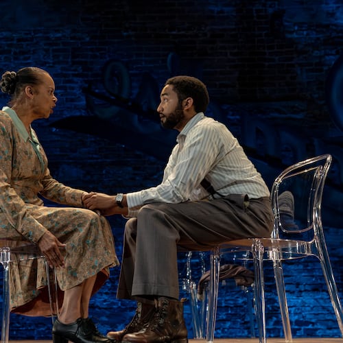 Terry Burrell as Amanda, shown here with her son, Tom (played by Stephen Ruffin), gives a mesmerizing performance as the unstable matriarch in “The Glass Menagerie” at Theatrical Outfit in Atlanta. (Courtesy of Casey Gardner Ford)