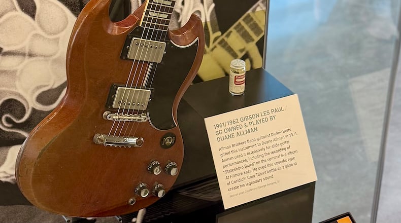 A 1961/1962 Gibson Les Paul SG guitar previously owned by Duane Allman, of the Allman Brothers Band, is on display at Akins Ford Arena in Athens, Ga., on Jan. 8, 2025. (Fletcher Page/AJC)