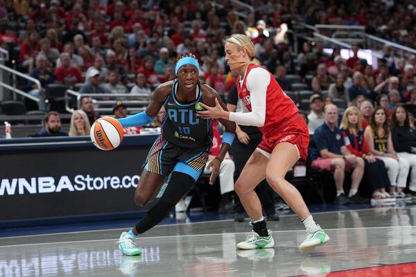 The Dream's Rhyne Howard (left) goes to the basket against the Fever's Sophie Cunningham on Friday, July 11, 2025, in Indianapolis. Howard finished the game with 14 points. (AJ Mast/AP)