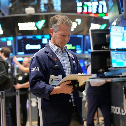 Bobby Charmak works on the floor at the New York Stock Exchange in New York, Friday, March 6, 2026. (AP Photo/Seth Wenig)
