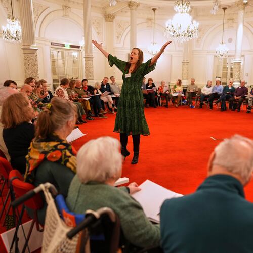 People, many of them seniors with a form of dementia, join in the "singing circle" run by opera singer Maartje de Lint, at the Concertgebouw's ornate Mirror Hall in Amsterdam on Feb. 24, 2026. (AP Photo/Peter Dejong)