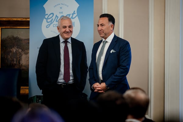 Jim Vena, CEO of Union Pacific Railroad and Union Pacific Corporation (left) and Mark R. George, CEO of Norfolk Southern, speak during a joint presentation at Railway Age’s Next Generation Freight Rail conference at the Union League Club of Chicago on March 10, 2026. (Jamie Kelter Davis for the AJC)