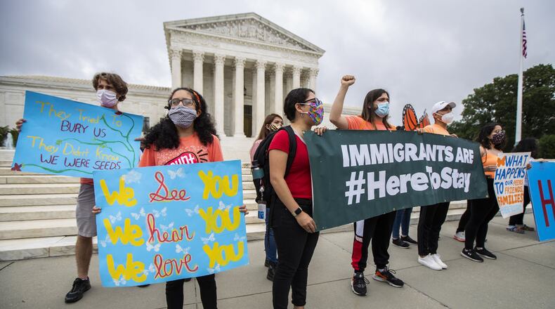 Deferred Action for Childhood Arrivals (DACA) students celebrate in front of the U.S. Supreme Court after the Supreme Court rejects President Donald Trump’s bid to end legal protections for young immigrants, Thursday, June 18, 2020, in Washington. (AP Photo/Manuel Balce Ceneta)
