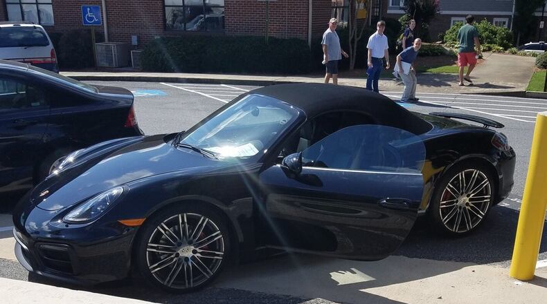 The owner of a Porsche has been charged with reckless conduct after a note stating his car was wired to explode was left in plain view. Credit: Marietta Police Department