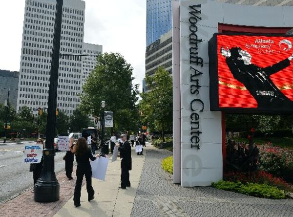 ASO musicians and supporters have picketed the Woodruff Arts Center since the lockout began earlier this month. KENT D. JOHNSON / KDJOHNSON@AJC.COM