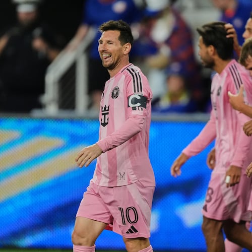 Inter Miami CF midfielder Lionel Messi, left, celebrates after scoring a goal during the second half of an MLS soccer game Wednesday, May 13, 2026, in Cincinnati. (AP Photo/Joshua A. Bickel)