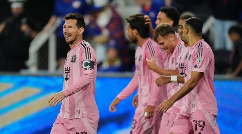 Inter Miami CF midfielder Lionel Messi, left, celebrates after scoring a goal during the second half of an MLS soccer game Wednesday, May 13, 2026, in Cincinnati. (AP Photo/Joshua A. Bickel)