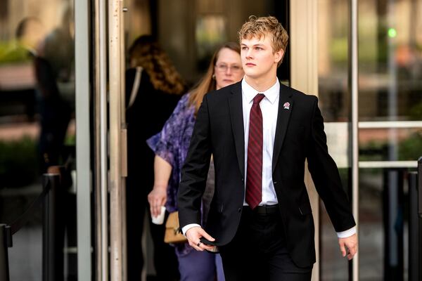 College swimmer Gannon Flynn leaves federal court during a hearing for a landmark $2.8 billion settlement impacting NCAA college athletics on Monday, April 7, 2025, in Oakland, Calif. (AP Photo/Noah Berger)