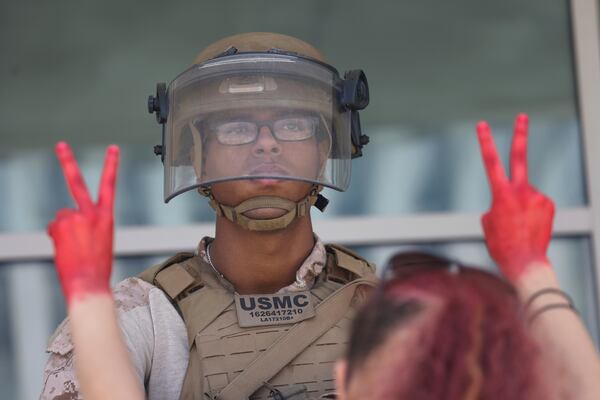 FILE - Protesters confront Marines outside the Federal Building on July 4, 2025 in Los Angeles. (AP Photo/Jill Connelly, file)