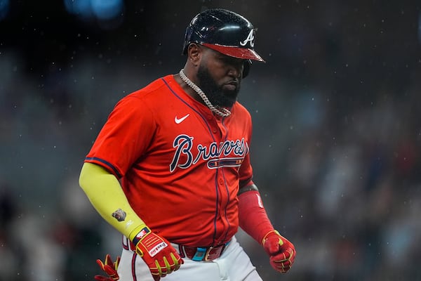 Atlanta Braves designated hitter Marcell Ozuna (20) celebrates his three-run home run against the Colorado Rockies in the seventh inning of a baseball game, Friday, June 13, 2025, in Atlanta. (AP Photo/Mike Stewart)