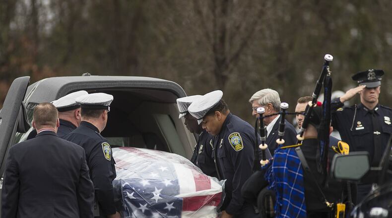 01/03/2019 — McDonough, Georgia — The casket of Henry County Police Officer Michael Smith is carried into Glen Haven Baptist Church in McDonough on Thursday. Smith, 33, was shot Dec. 6 while responding to a report of an irate man at a McDonough-area dental office. Three weeks later, Smith died from his injuries. (ALYSSA POINTER/ALYSSA.POINTER@AJC.COM)