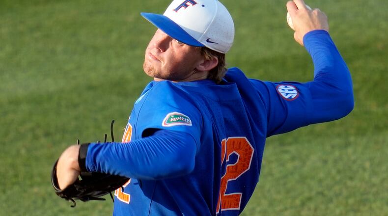 Florida pitcher Hurston Waldrep (12) throws against South Carolina in an NCAA college baseball tournament super regional game Saturday, June 10, 2023, in Gainesville, Fla. (AP Photo/John Raoux)