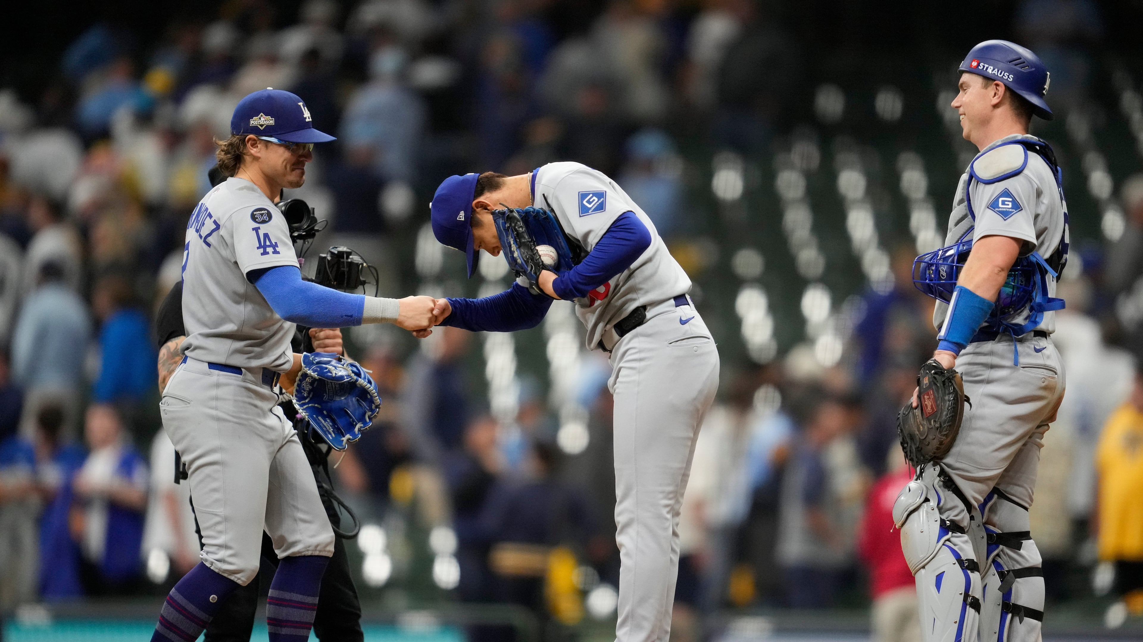 Los Angeles Dodgers pitcher Yoshinobu Yamamoto celebrates throwing a complete game against the Milwaukee Brewers, in Game 2 of baseball's National League Championship Series, Tuesday, Oct. 14, 2025, in Milwaukee. (AP Photo/Ashley Landis)
