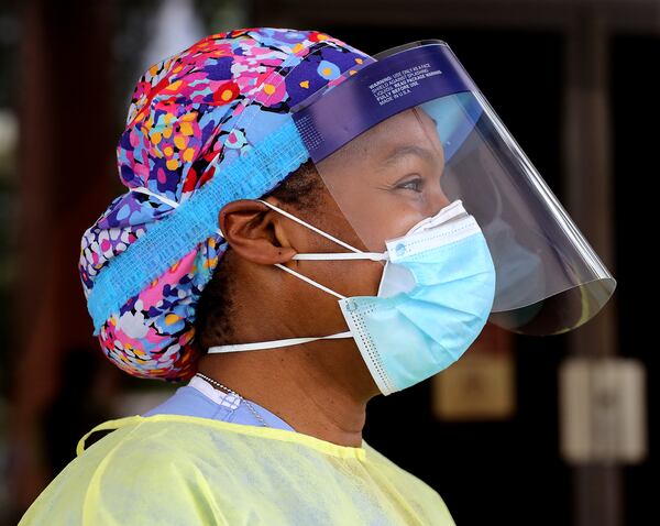 Wendy Greene, an Emory Hospital MD, volunteers her time to help take free COVID-19 testing at a pop-up site at the House of Hope on Monday, May 4, in Decatur. Pastors, local physicians, health ministers, and other community leaders united to encourage area residents to get tested.  