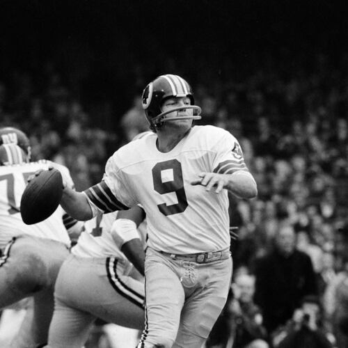 FILE - Washington quarterback Sonny Jurgensen looks to pass against the New York Giants during an NFL football game in 1974. (AP Photo/File)