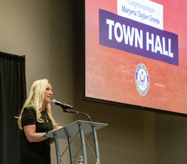 U.S. Rep. Marjorie Taylor Greene holds a town hall in Acworth on Tuesday, April 15, 2025. Protesters lined the street outside and disrupted the meeting multiple times.  (Jenni Girtman for The Atlanta Journal-Constitution)