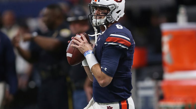 Auburn quarterback Jarrett Stidham (8) warms up before the first half of the Southeastern Conference championship NCAA college football game between Auburn and Georgia, Saturday, Dec. 2, 2017, in Atlanta. (AP Photo/John Bazemore)