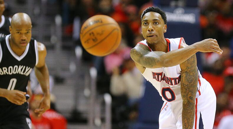 Hawks guard Jeff Teague makes a long pass down court on a fast break against Nets Jarrett Jack on a steal during Game 5 of their first round playoff matchup on Wednesday, April 29, 2015, in Atlanta.