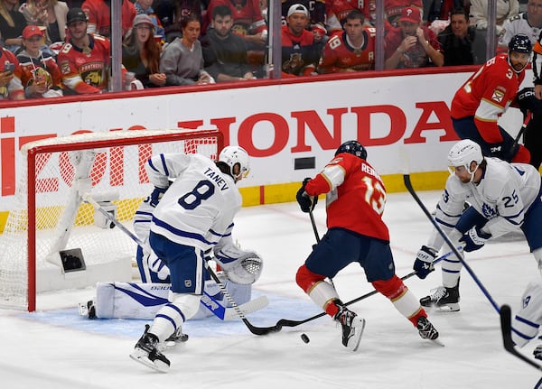 Florida Panthers center Sam Reinhart (13) tries to score against the Toronto Maple Leafs during the first period of Game 4 of a second-round NHL hockey playoff series, Sunday, May 11, 2025, in Sunrise, Fla. (AP Photo/Michael Laughlin)
