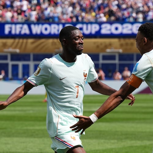 France's Ousmane Dembele celebrates with Kylian Mbappe, right, after scoring his side's third goal during the World Cup Group I soccer match between Norway and France in Foxborough, Mass., near Boston, Friday, June 26, 2026. (AP Photo/Martin Meissner)