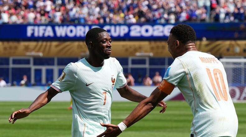 France's Ousmane Dembele celebrates with Kylian Mbappe, right, after scoring his side's third goal during the World Cup Group I soccer match between Norway and France in Foxborough, Mass., near Boston, Friday, June 26, 2026. (AP Photo/Martin Meissner)