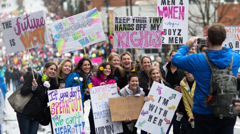 Marchers headed for Liberty Plaza in Atlanta pose for a photograph on Jan. 21, 2017. BRANDEN CAMP/SPECIAL