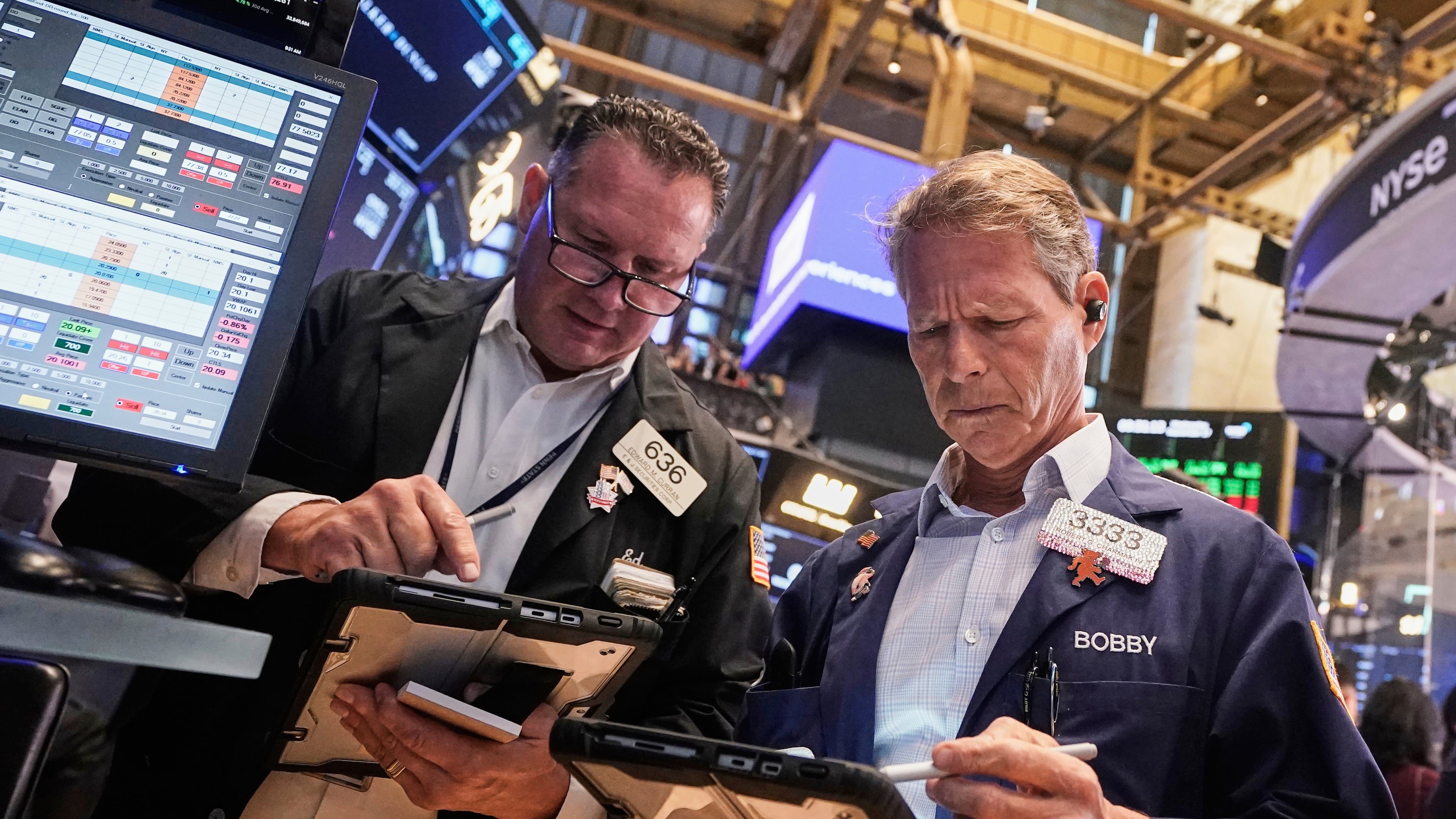 Traders Edward Curran, left, and Robert Charmak work on the floor of the New York Stock Exchange, Wednesday, Sept. 17, 2025. (AP Photo/Richard Drew)