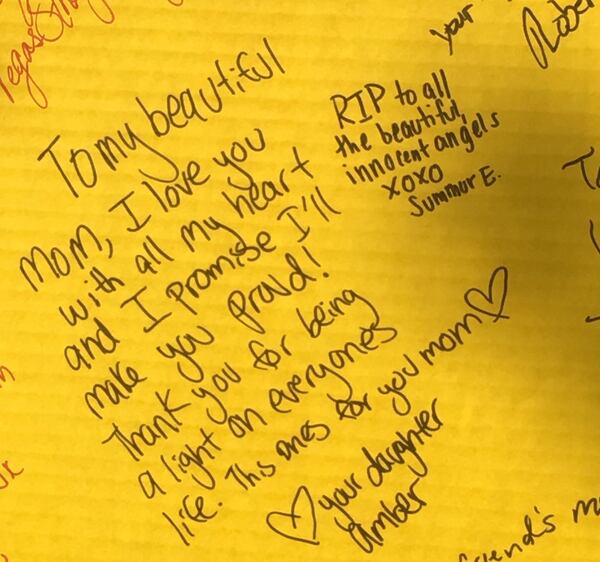 Heartbreaking messages like this one filled a board at the impromptu memorial site set up in front of the famed Bellagio to honor victims. Photo: Jennifer Brett, jbrett@ajc.com