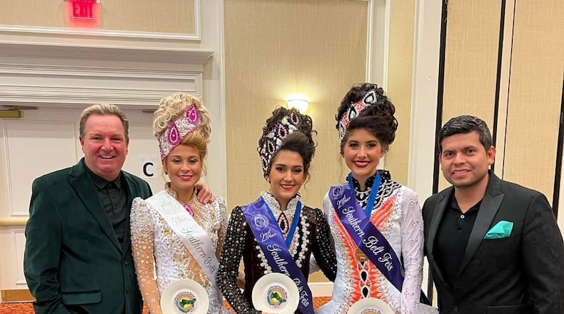 Karl Drake, founder of Drake School of Irish Dance, is shown here with three of his students who recently competed at Palmetto State Feis in Spartanburg, SC. The next stop for these 3 girls will be in Belfast for the upcoming World Championship of Irish Dancing. (Pictured L-R: Karl Drake, Danna Maki-Florida, Luisa Diaz-National champion from Drake Mexico, Ashlea DelFavero-Atlanta and Cesar Hernandez, husband of Drake).