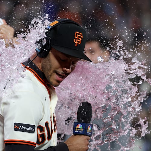 San Francisco Giants' Grant McCray is doused by teammates after their team's victory over the Milwaukee Brewers during a baseball game in San Francisco, Monday, July 27, 2026. (AP Photo/Jed Jacobsohn)