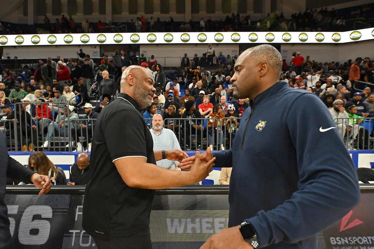 McEachern's head coach Tremayne Anchrum and Wheeler's head coach Larry Thompson shake hands after McEachern beat Wheeler during GHSA Class 7A Semifinal basketball game at GSU’s Convocation Center, Saturday, Mar. 2, 2024, in Atlanta. (Hyosub Shin/AJC)