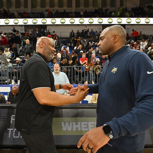 McEachern's head coach Tremayne Anchrum and Wheeler's head coach Larry Thompson shake hands after McEachern beat Wheeler during GHSA Class 7A Semifinal basketball game at GSU’s Convocation Center, Saturday, Mar. 2, 2024, in Atlanta. (Hyosub Shin/AJC)