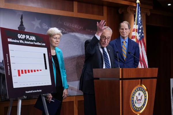 Senate Minority Leader Chuck Schumer, D-N.Y., is joined by Sen. Elizabeth Warren, D-Mass., left, ranking member of the Senate Banking, Housing, and Urban Affairs Committee, and Sen. Ron Wyden, D-Ore., the ranking member of the Senate Finance Committee, as he talks to reporters about Senate Republicans' efforts to pass President Donald Trump's tax cut and spending agenda with deeper Medicaid cuts, at the Capitol in Washington, Wednesday, June 18, 2025. (AP Photo/J. Scott Applewhite)