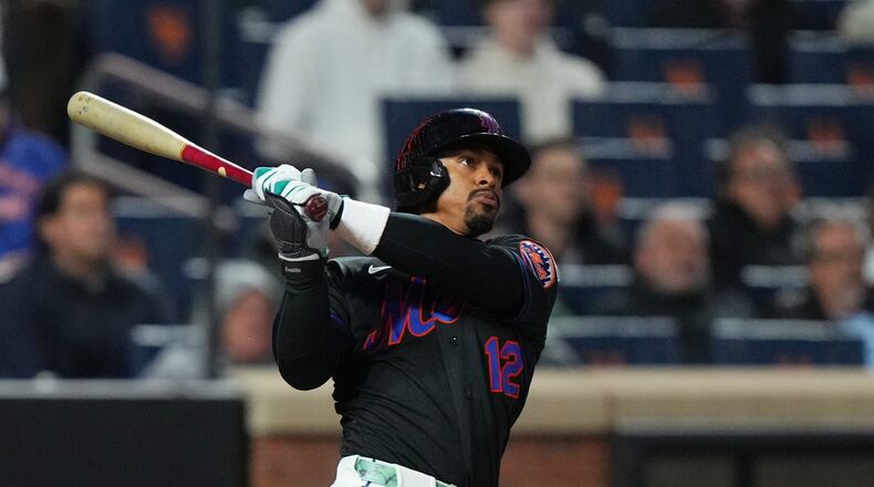 New York Mets' Francisco Lindor follows through on a three-run home run during the third inning of a baseball game against the Minnesota Twins Tuesday, April 21, 2026, in New York. (AP Photo/Frank Franklin II)